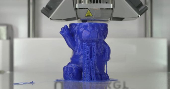 Printer working on printing childrens toy. Printing technology