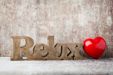 Relax. Message of home with wooden letters.
