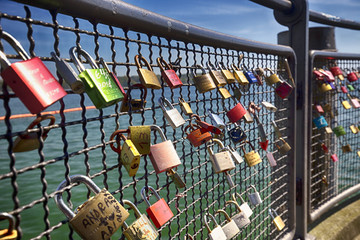 Padlocks in harbor of Konstanz city with a view to lake Constance.  Konstanz is a city located in...