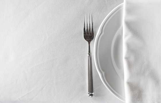 white empty plate with fork