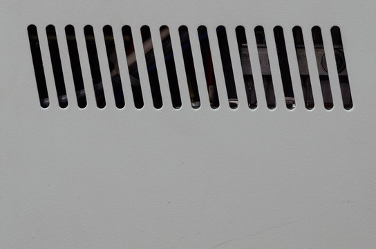 Power supply vent strips on beige powder coated surface