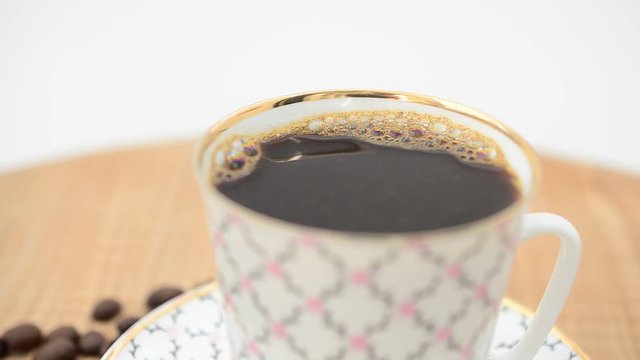 Coffee, coffee cup and grains.