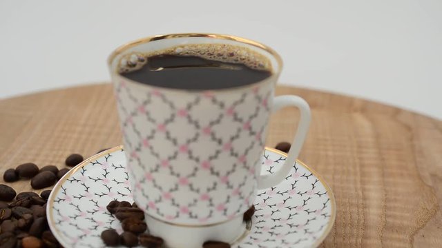 Coffee, coffee cup and grains.