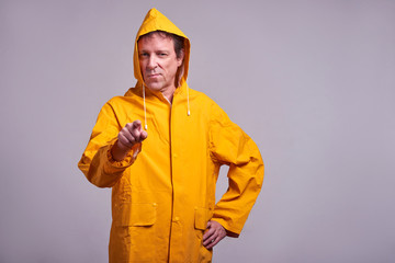 Man in yellow raincoat