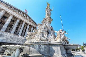 Fototapeta na wymiar Austrian parliament building with famous Pallas Athena fountain.