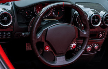 Dashboard and instrument panel, steering wheel in the sport racing car