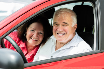 Couple Sitting In A Car