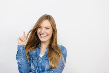 Cheerful young lady is smiling.