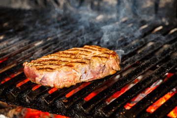 Beef steak fried on a grill