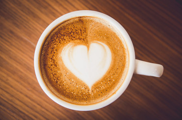 Close up Coffee latte art on wood background