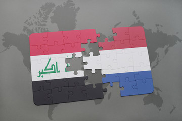 puzzle with the national flag of iraq and netherlands on a world map background.