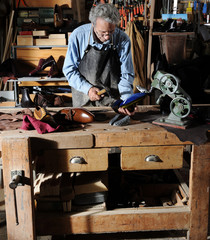 craftsman making luxury handmade man shoes