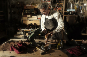 craftsman making luxury handmade man shoes