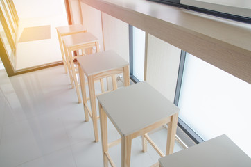 Cafe bar interior - wooden bar and bar chairs