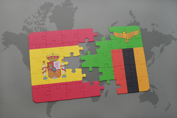 puzzle with the national flag of spain and zambia on a world map background.