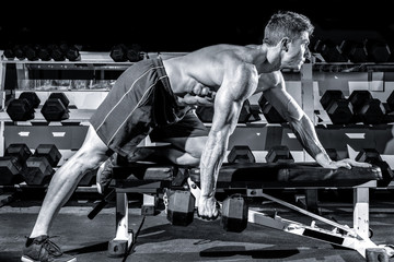 Fototapeta na wymiar Man working out in a gym