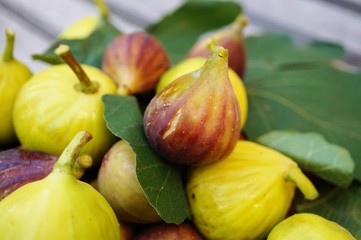 Very ripe green and purple figs in summer