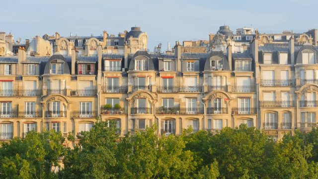 generic parisian house building in the neighborhood of the seine river and eiffel tower