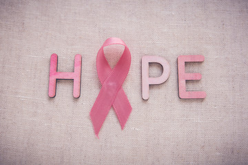 Pink Ribbons and HOPE word, toning background, Breast cancer awareness