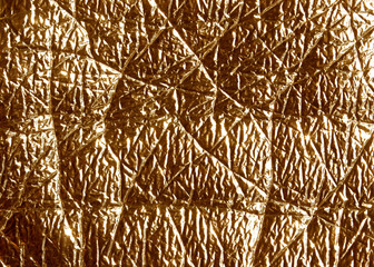 Orange metal foil surface.