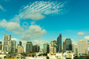 Sunshine morning time of Bangkok city. Bangkok is the capital and the capital city of Thailand. Cityscape with white cloud and blue sky in a sunshine day.