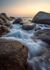 Seascape with strong motion wave in sunset time at Leam Sai in Phuket, Thailand, Blurred background