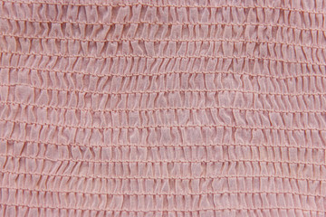 Pleated fabric background texture. pattern of fabric in the crea