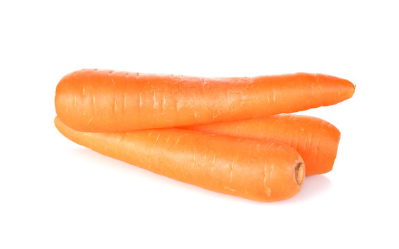whole unpeeled carrot on white background