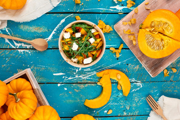 Pumpkin salad on the table, healthy bright organic food