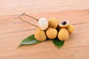 Fresh longan bundle on wooden table