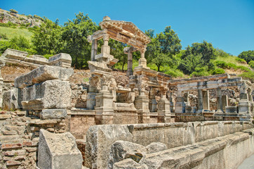 ancient ruins against green hill and blue sky