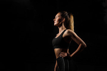 Studio shot of a beautiful young woman posing against a black background. This is what hard work and dedication looks like