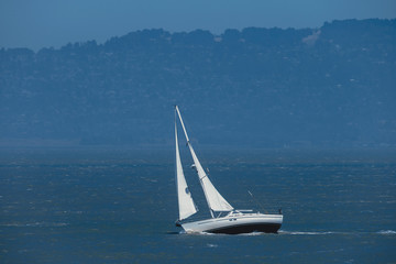 White yacht sails