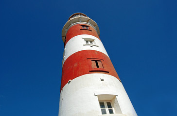 Low angle shot of lighthouse on sky background