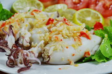 steamed squid stuffed minced pork dressing spicy lemon sauce on dish