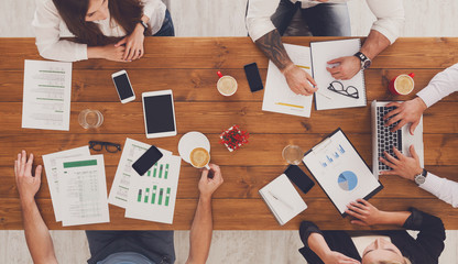 Group of busy business people working in office, top view