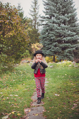 Girl walks in the park autumn day