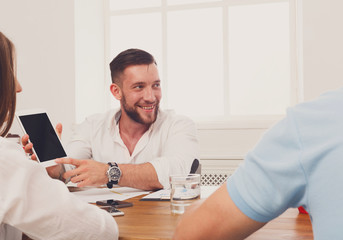 Obraz premium Business meeting. Young hipster businessman in modern office