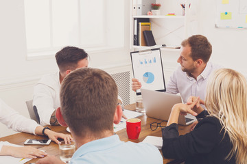 Obraz premium Business meeting. Young hipster businessman in modern office