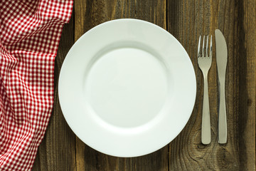 Empty Plate And Cutlery On The Wooden Table./Empty Plate And Cutlery On The Wooden Table 