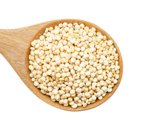 Raw white quinoa seeds in wooden spoon.