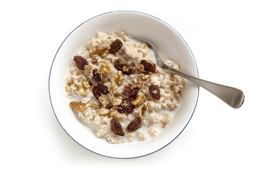 Oatmeal with Raisins Walnuts and Brown Sugar Isolated Top View