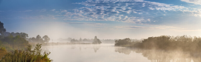 Fototapeta na wymiar Foggy river in the autumn morning