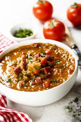 Lentil soup with tomatoes and sausages