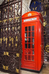 Obraz premium Popular tourist Red phone booth in night lights illumination in London, England, United Kingdom