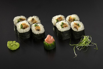 fresh made Japanese sushi rolls with cucumbers decorated with wa