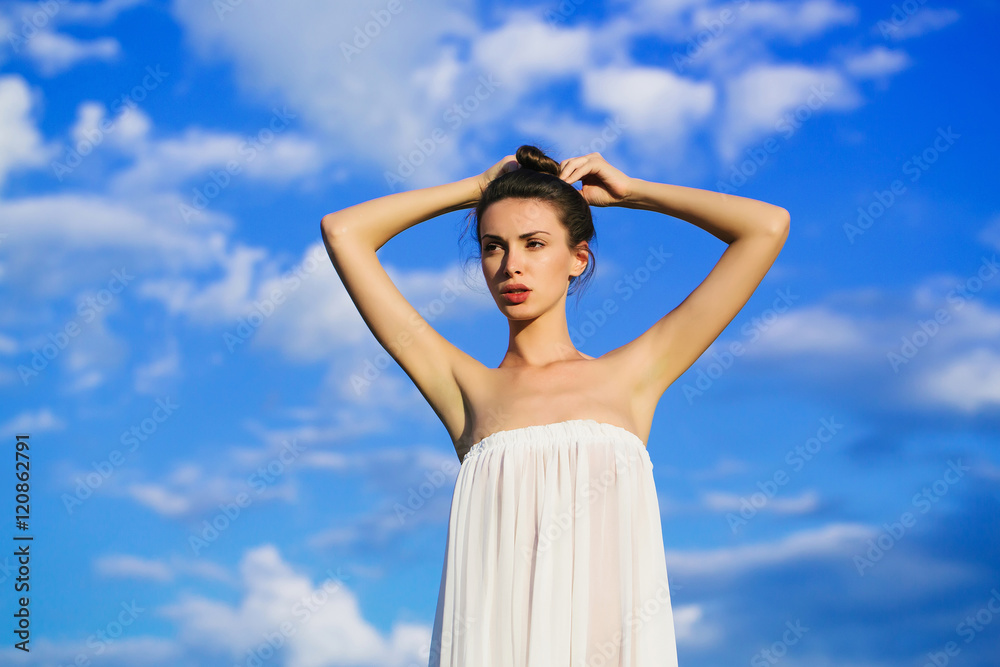 Wall mural pretty girl over blue sky