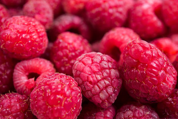 Fresh ripe raspberries macro shot, summer fruit background