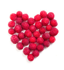 Fresh ripe raspberries heart shaped macro shot 