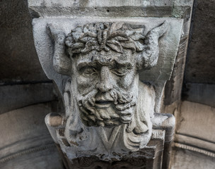 Satyr head decoration above door